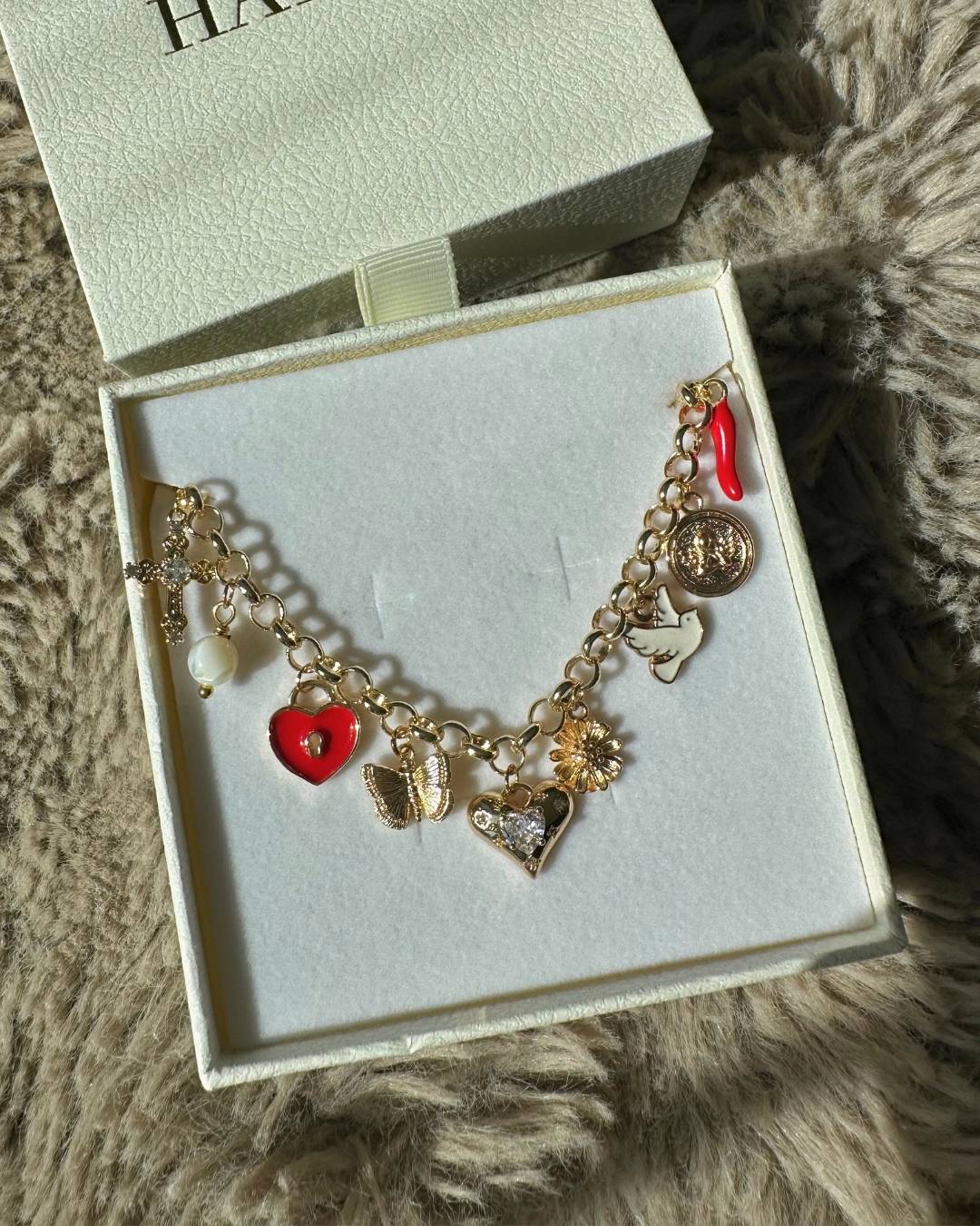 y2k charm necklace with red and gold charms