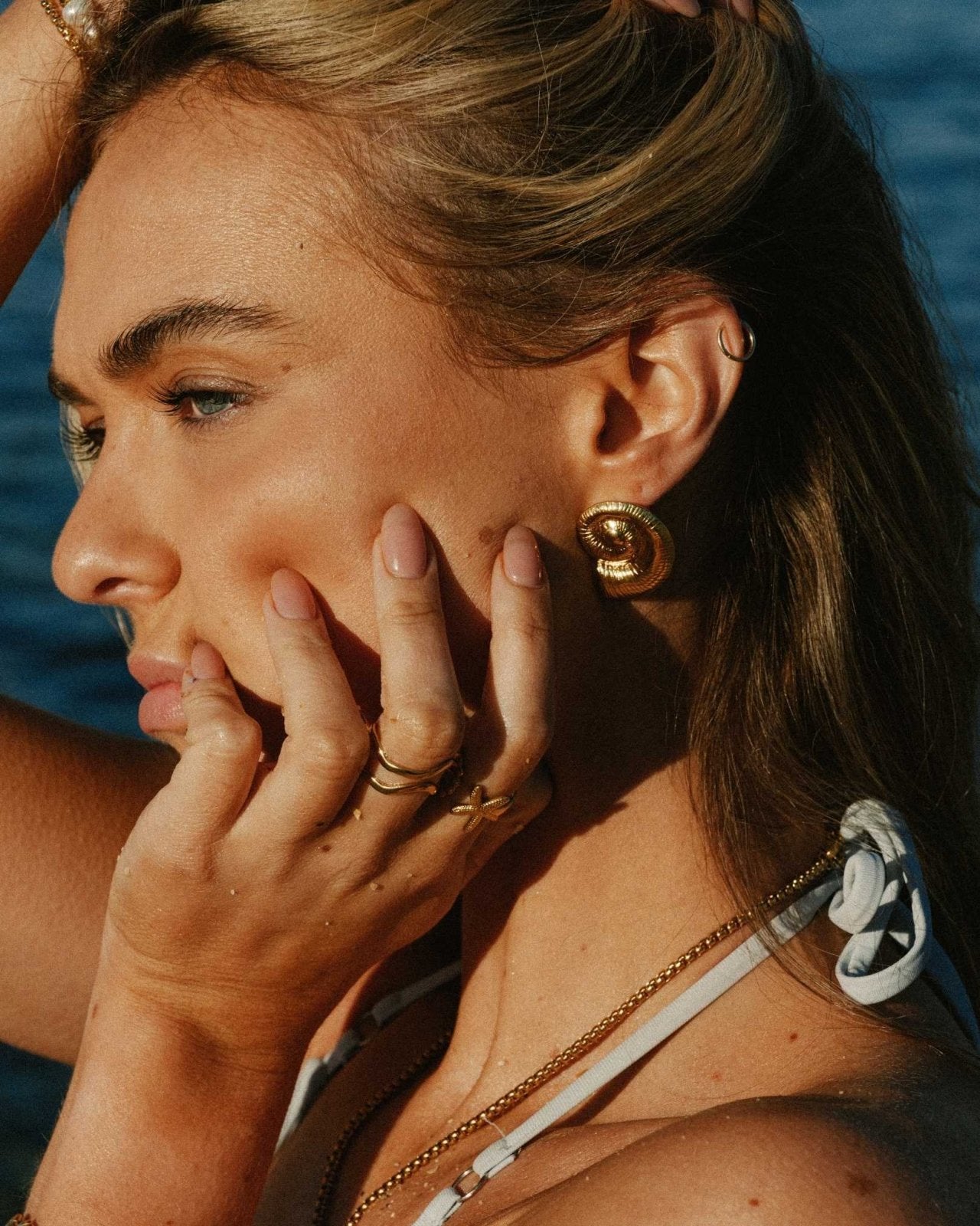 gold sea shell stud earrings - Haylo & Co.