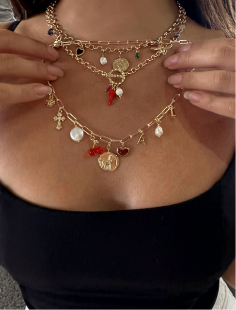 layred necklace stack with charm necklaces