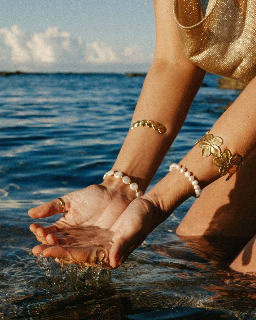 waterproof gold bracelet stack with Chunky Flower Bracelet Cuff, Coin Pearl Bracelet, Wavy Pearl Bracelet and Chunky Shell Bracelet Cuff - Haylo & Co. Jewellery